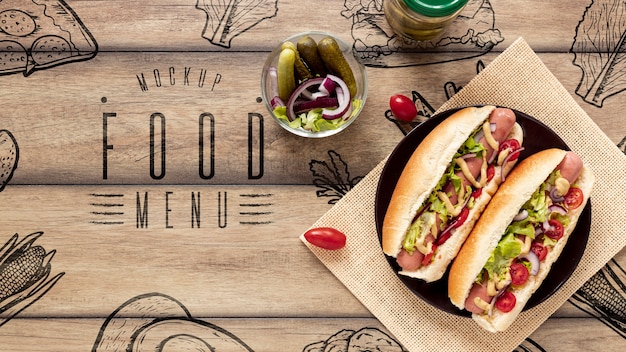 top view of delicious hot dogs on wooden table