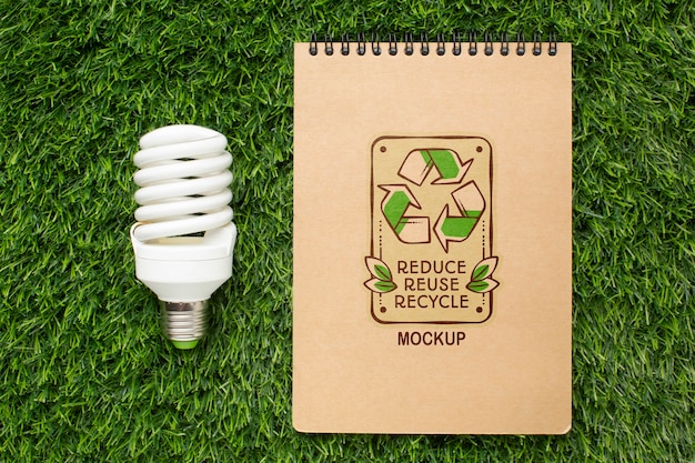 PSD top view eco notebook mock-up with lightbulb