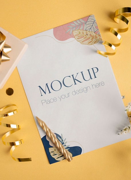 top view of elegant birthday card with ribbon and candle