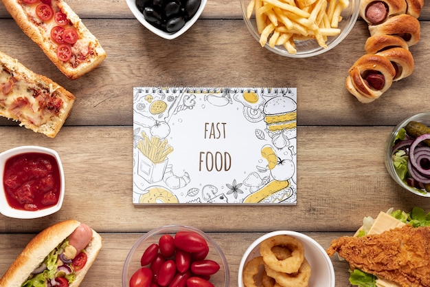 Top view of fast food mock-up on wooden table