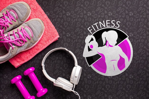 Top view fitness equipment and headphones