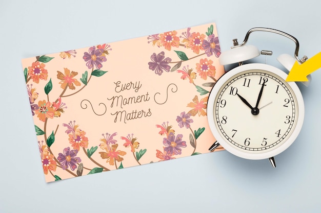 PSD top view of floral card with clock