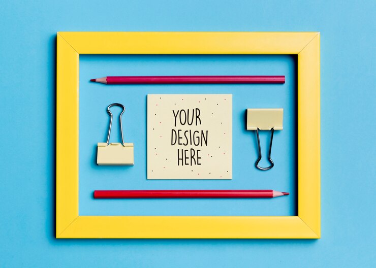 PSD top view frame with paper clips and pencils