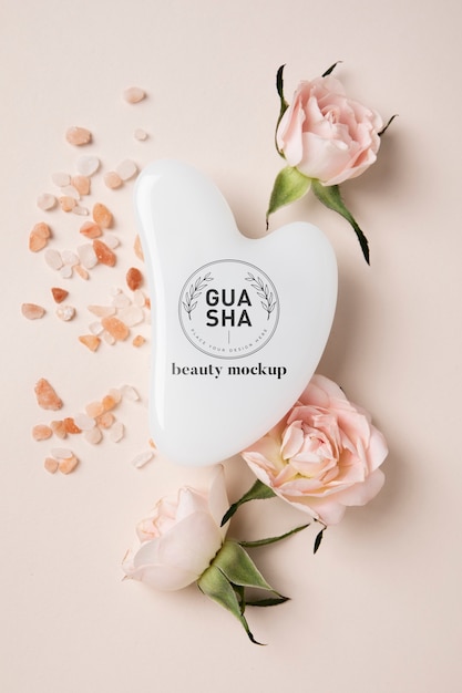 Top view gua sha and flowers