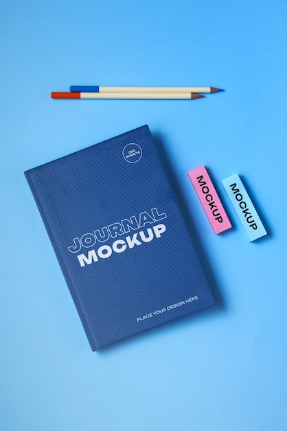 Top view of journal mock-up with colorful stationery