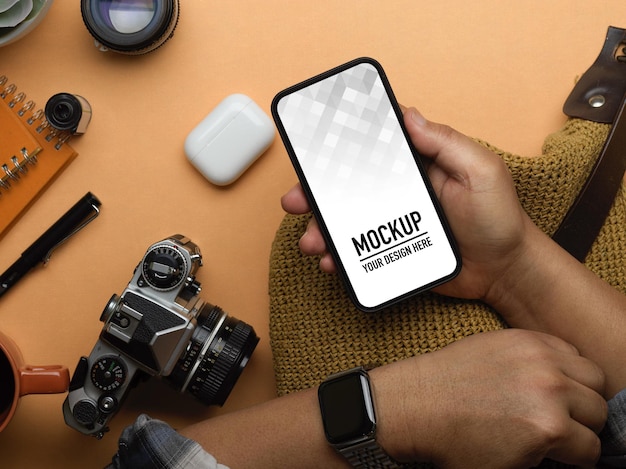 top view of male hand using smartphone mockup