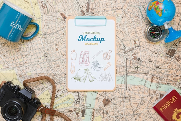 Top view of map with mock-up traveling essentials