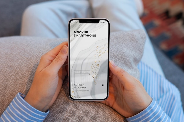 top view model holding a smartphone