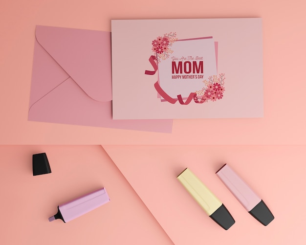 PSD top view mother's day card and envelope with mock-up