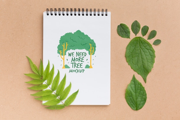 PSD top view notebook mock-up with leaves