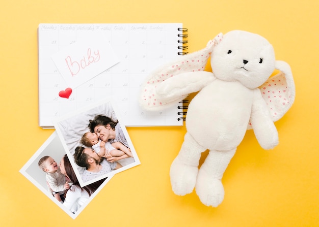 PSD top view of notebook with bunny and photos