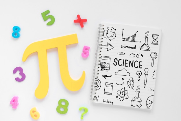 Top view of notebook with pi sign