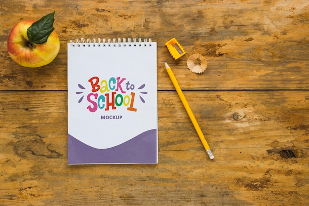 Top view notebook on wooden background