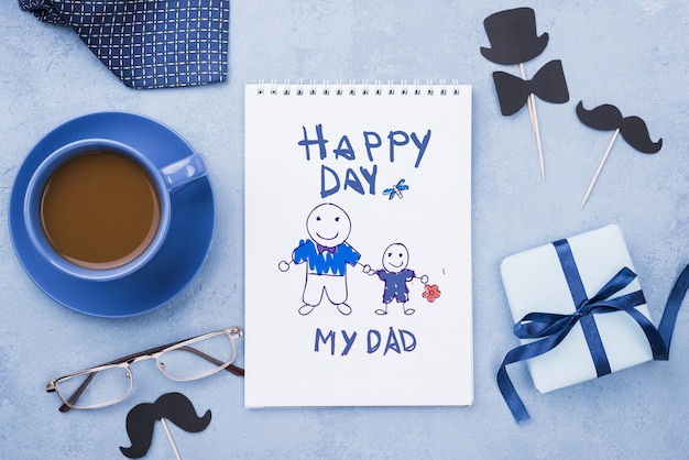 top view of notepad with coffee and glasses for fathers day