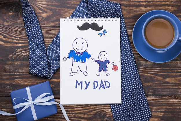 PSD top view of notepad with tie and coffee for fathers day