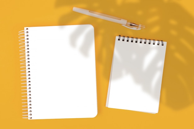 Top view notepad on yellow background, mockup, scene creator