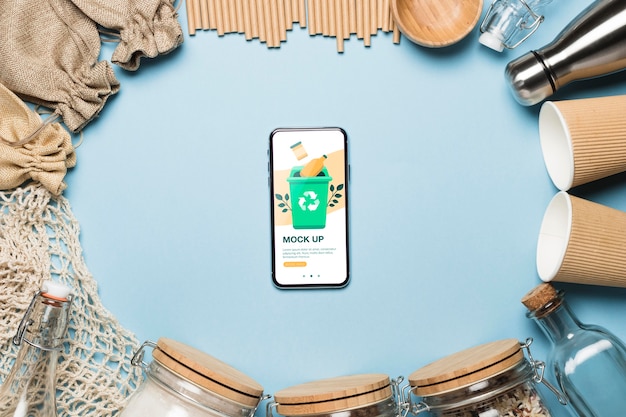 PSD top view of paper cups and zero waste items with smartphone