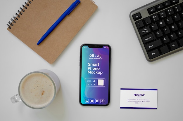 Top view over phone and business card mockup