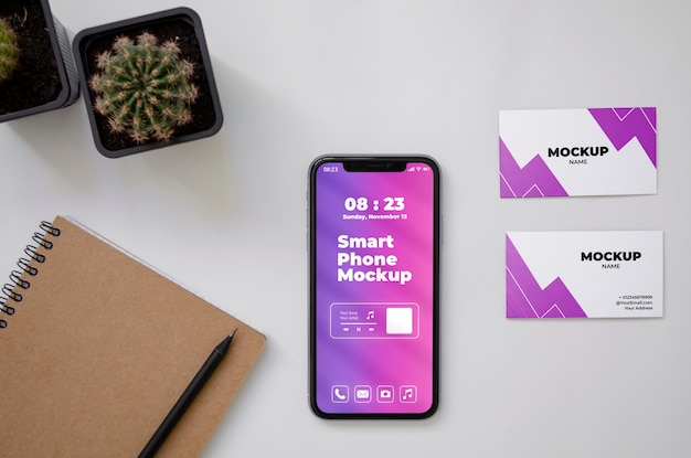 PSD top view over phone and business card mockup