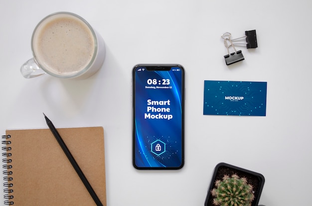 top view over phone and business card mockup