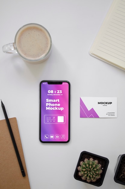 PSD top view over phone and business card mockup