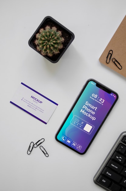PSD top view over phone and business card mockup