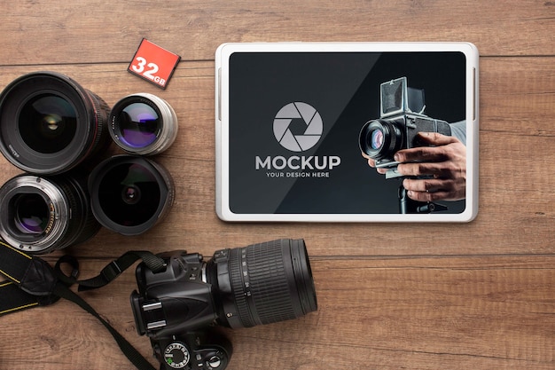 Top view of photographer wooden workspace with tablet