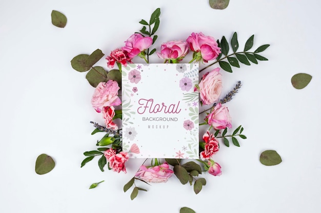 Top view pink roses and leaves framing mockup