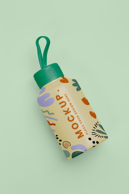 PSD top view reusable bottle on green background