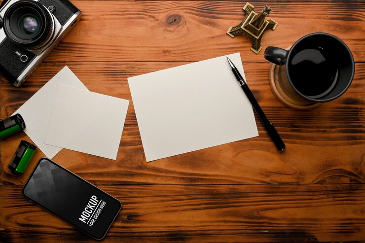 PSD top view of rustic table with smartphone mockup