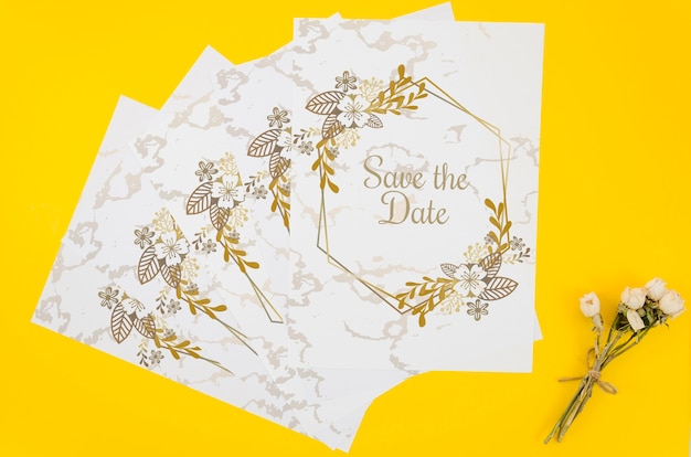 Top view save the date mock-up on yellow background