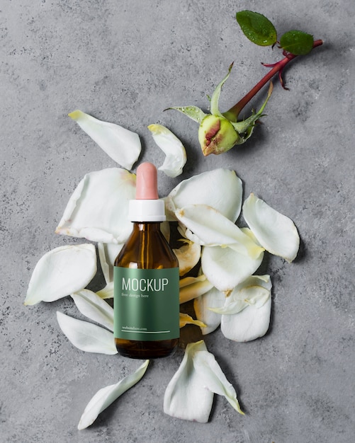 Top view serum with petals flowers