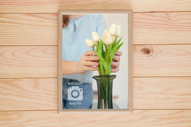 Top view of simple frame on wooden background