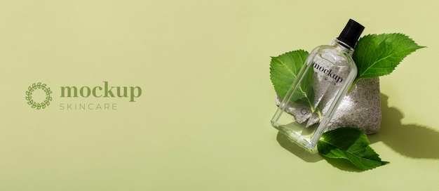 Top view skin care product with leaves