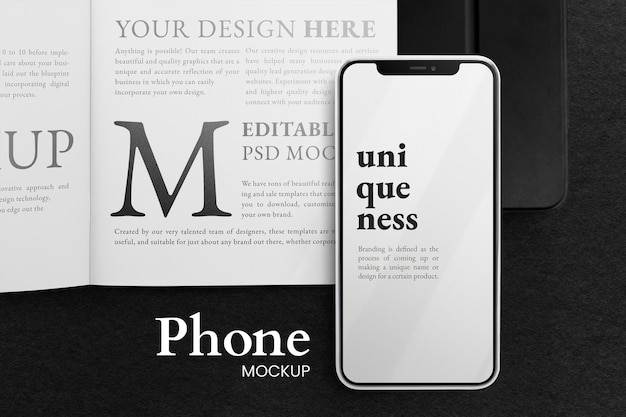 Vista dall'alto su smartphone e mockup di libri