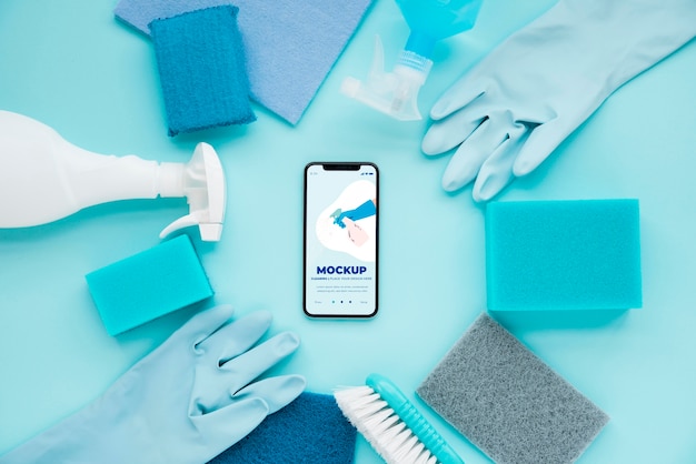 top view of smartphone and cleaning solutions