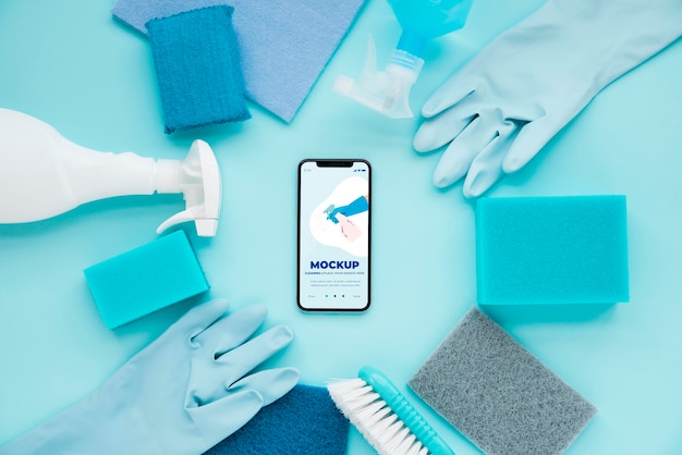 Top view of smartphone and cleaning solutions