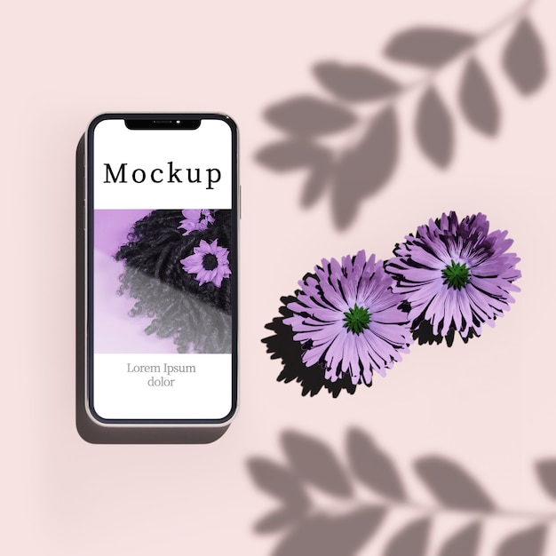 PSD vista dall'alto di smartphone con fiori e ombra
