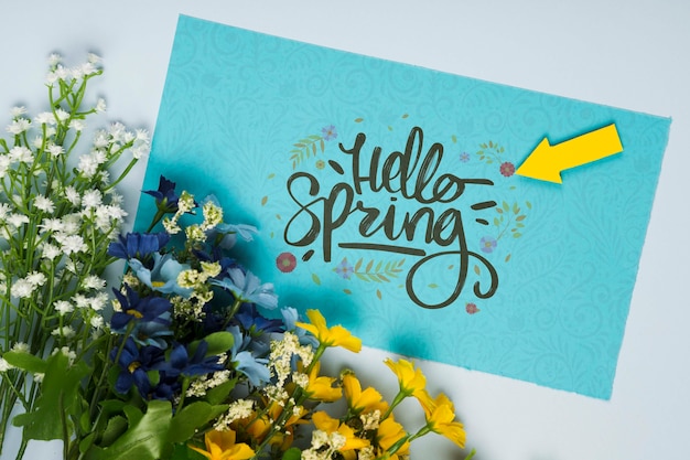 Top view of spring flowers with card