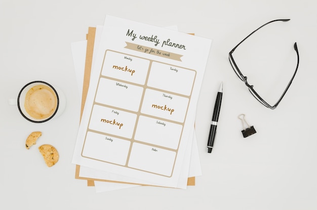 PSD top view stationery mock-up with reading glasses