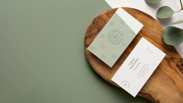 top view stationery on wood  with leaves