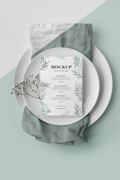 Top view of table arrangement with plates and spring menu mock-up