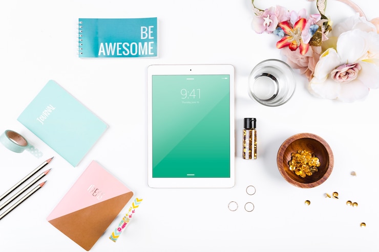PSD top view tablet mockup on workspace