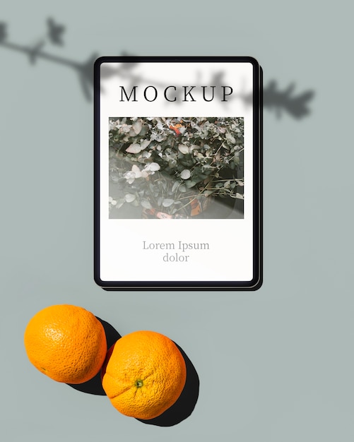 top view of tablet with oranges