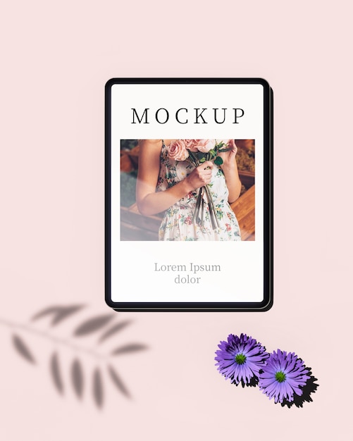 top view of tablet with photo and flowers