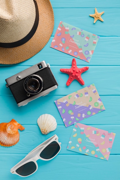 Top view travel camera with hat and sunglasses