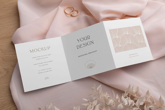 Top view on trifold wedding invitation mockup