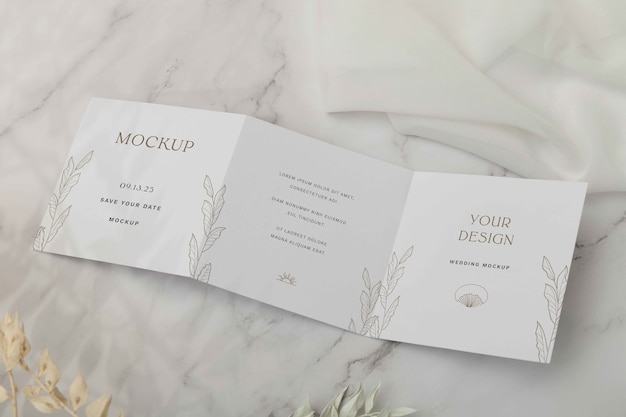 Top view on trifold wedding invitation mockup