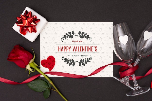 PSD top view of valentine's day concept with rose and champagne glass