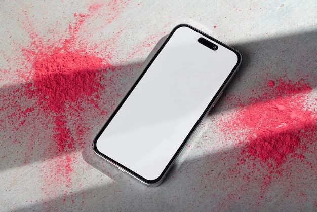 PSD top view van het holi-festival met een smartphone-mockup